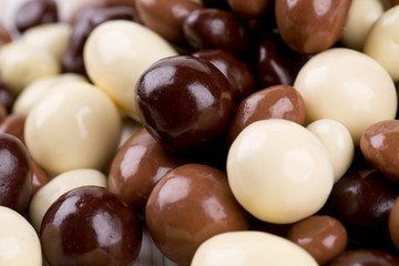 chocolate covered nuts and raisins background