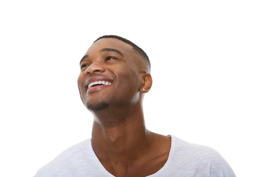 Close up portrait of a happy young african american man laughing