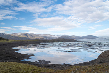 Scenic view of wild Icelandic landscape with ice lagoon.