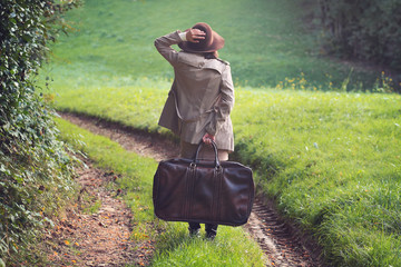 Elegant woman lost in a country road