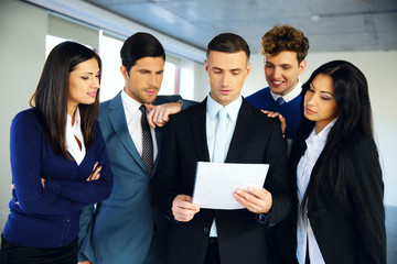 Business people reading a document together