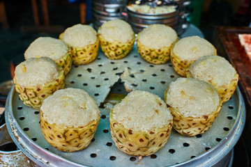 Obraz na płótnie Canvas sticky rice steamed pineapple traditional food Sichuan China