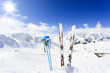 Ski , mountains and ski equipments on ski run - obrazy, fototapety, plakaty