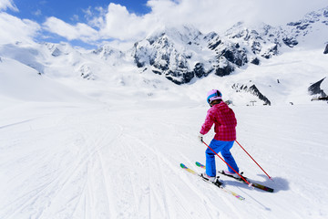 Fototapeta na wymiar Skiing, downhill - skier on mountainside