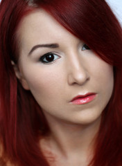 Fototapeta premium Beautiful redhead young woman with bright make up portrait