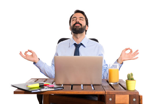 Businessman In His Office  In Zen Position