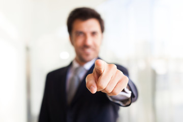 Businessman pointing his finger at you