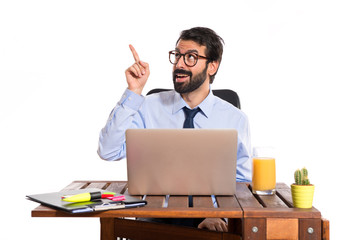 Businessman in his office thinking over white background