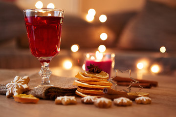 Glass of mulled wine with orange and spices