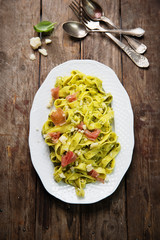 Pasta with pesto and prosciutto ham