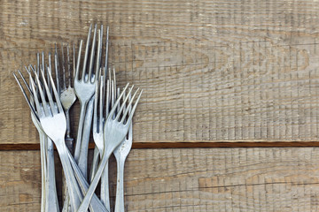 Retro forks on wooden table