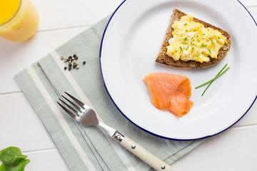 Top view of healthy breakfast with scrambled eggs