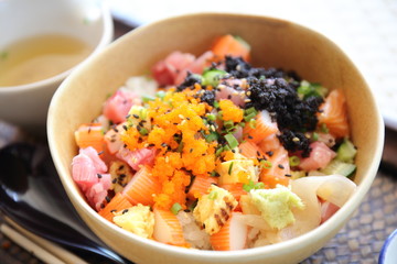 Sushi don , raw salmon tuna octopus on rice