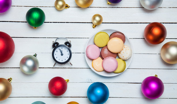 Clock and cookies with christmas toys.