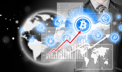 Choosing bitcoins, businessman pressing touch screen button.