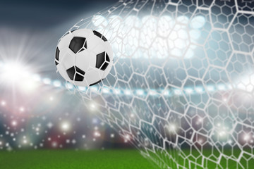 soccer ball in goal net