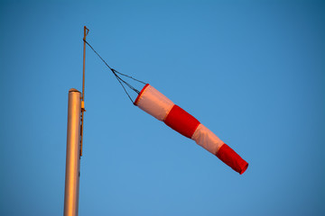 Close up of a wind sock under a blue sky