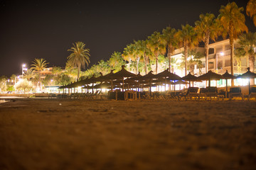 Plenty of sun loungers on the beach at night.