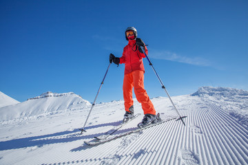 Skier is posing at camera