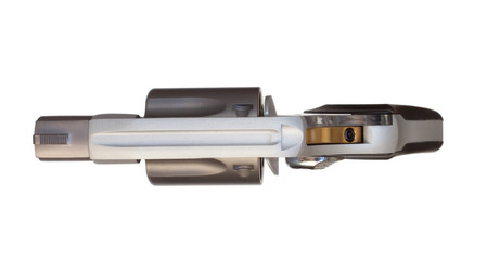 Top view of a revolver with a gold colored hammer.