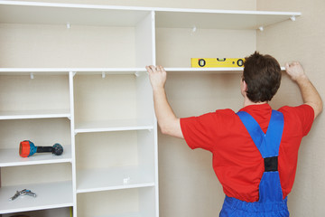 Wardrobe joiner at installation work