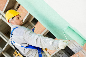 builder facade painter at work