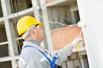 builder facade painter at work