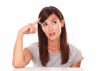 Fototapeta premium Pretty woman wondering while looking to her left