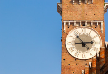 Fototapeta na wymiar Closeup view of tower clock of Lamberti Tower at right side