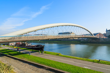Bernatka bridge over Vistula river on sunny day, Krakow, Poland