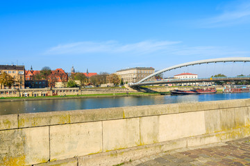 Bernatka bridge over Vistula river on sunny day, Krakow, Poland