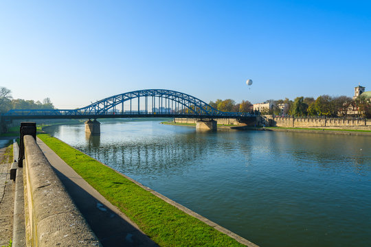 Bridge over Vistula river on sunny day in city of Krakow, Poland