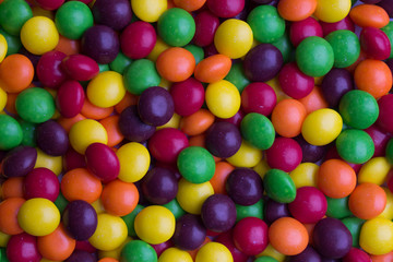 Fototapeta na wymiar Background of coated multicolored candy