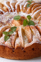 apple pie with mint sprinkled with powdered sugar. vertical