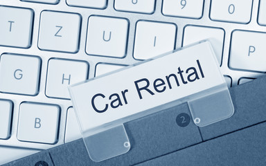 Car Rental - Folder on keyboard in the office