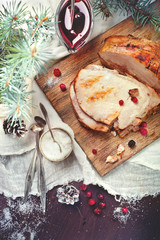 Fototapeta na wymiar Homemade roasted pork for Christmas dinner, with seasonings