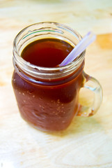 Obraz na płótnie Canvas Iced Black Tea With Purple Straw