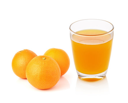 fresh orange fruits and juice isolated on white