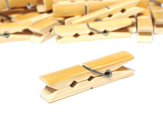 Wooden clothes pin isolated on white background