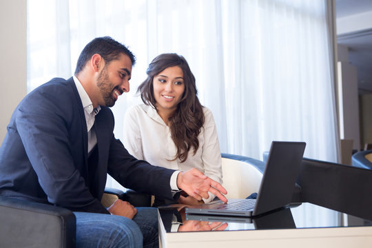 Business couple with computer