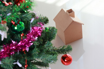 christmas decoration with small wooden house and tree