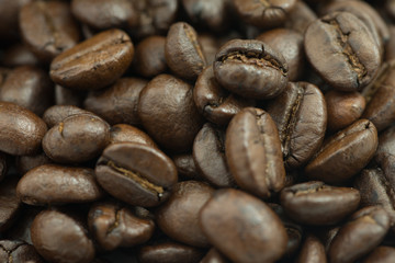 Roasted coffee beans macro closeup background