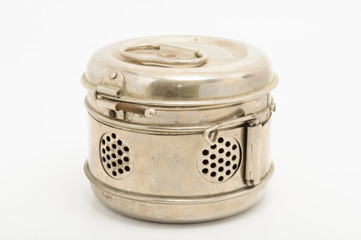 Vintage sterilisation container on white background