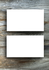 Blanks white business cards on a wooden background