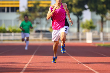 Male runner running in track - 72588276