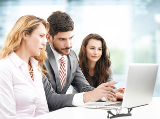 Teamwork with laptop at office