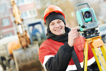 surveyor works with theodolite