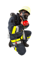 Naklejka premium Fireman in uniform isolated in white