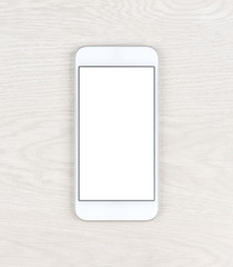 Stylish white smartphone over table