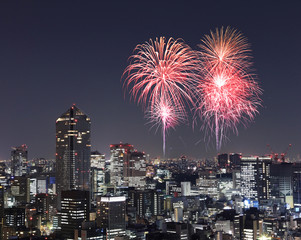 Fireworks celebrating over Tokyo cityscape at night